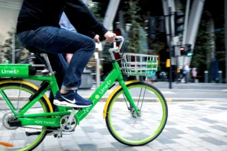 Man riding original UK lime bike